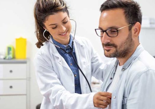 Cardiologist checking a patients heart beat