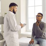 doctor examining patient