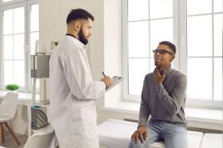 doctor examining patient