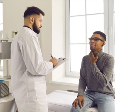 doctor examining patient