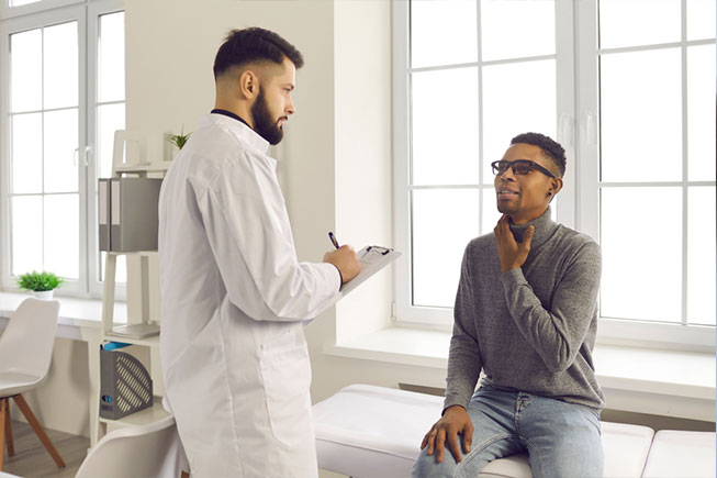 doctor examining patient